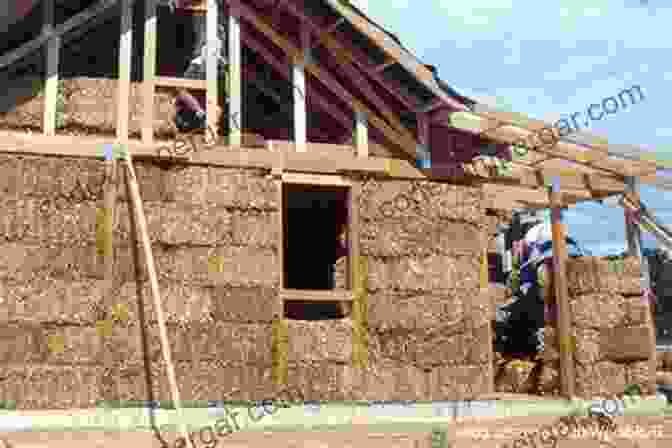 A Close Up Of Straw Bale Construction, Highlighting The Intricate Layering And Compacting Process. Buildings Of Earth And Straw: Structural Design For Rammed Earth And Straw Bale Architecture