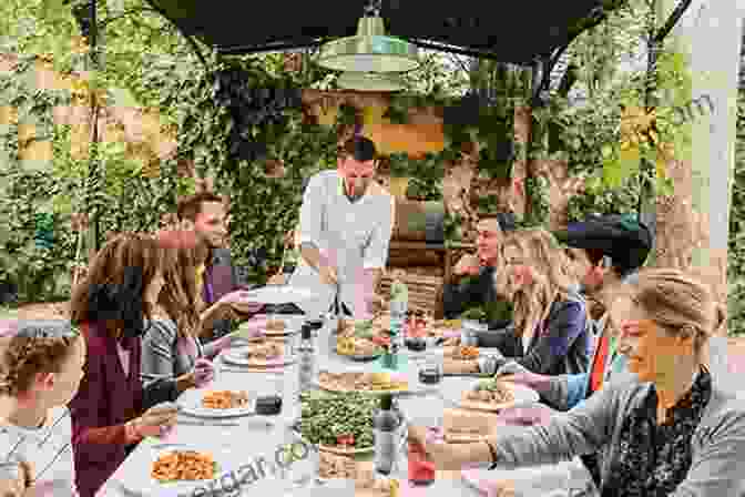 A Group Of People Enjoying A Meal In An Outdoor Dining Area Design For Story: Create Immersive Outdoor Living Experiences